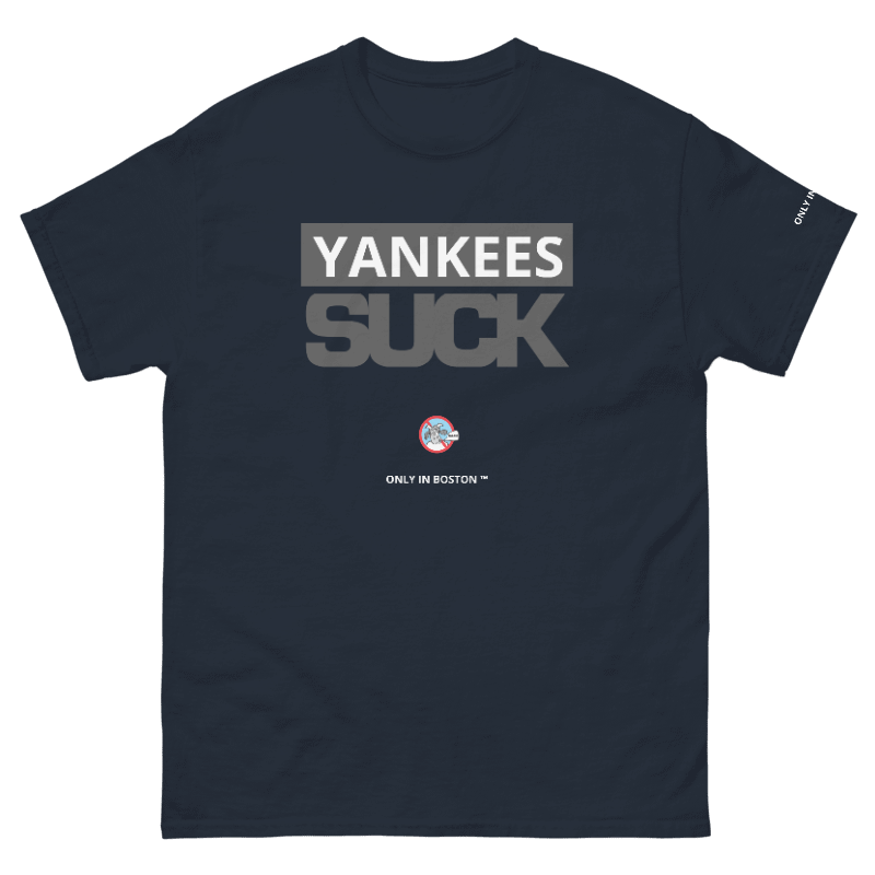 A navy blue short-sleeve t-shirt with a graphic print on the front reading 'YANKEES SUCK' in gray and white, with a small circular logo and 'ONLY IN BOSTON' underneath.