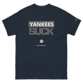 A navy blue short-sleeve t-shirt with a graphic print on the front reading 'YANKEES SUCK' in gray and white, with a small circular logo and 'ONLY IN BOSTON' underneath.